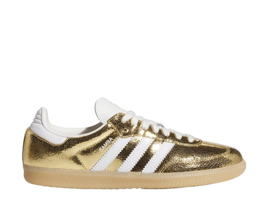 Gold Adidas sneaker with white stripes on a white background