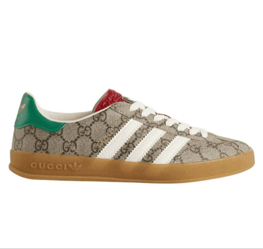 Sneaker with Gucci and Adidas logos on a white background