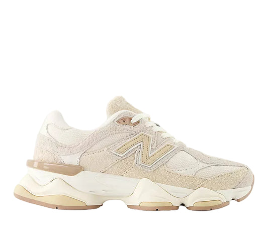 Beige sneaker with a brand logo on a white background